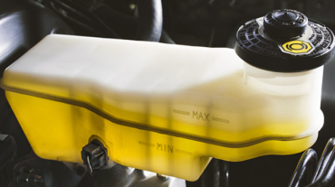 expansion tank with yellow brake fluid