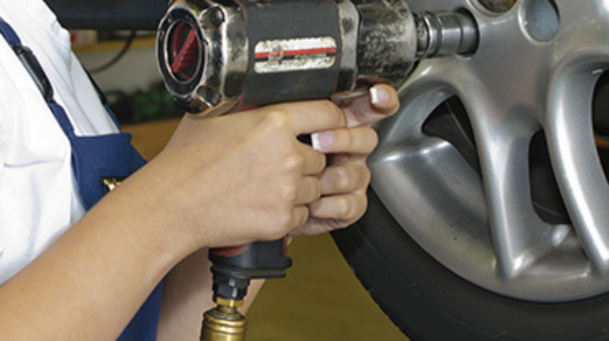 Power impact wrench in use