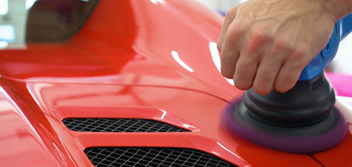 Professional car detailing with buffing machine